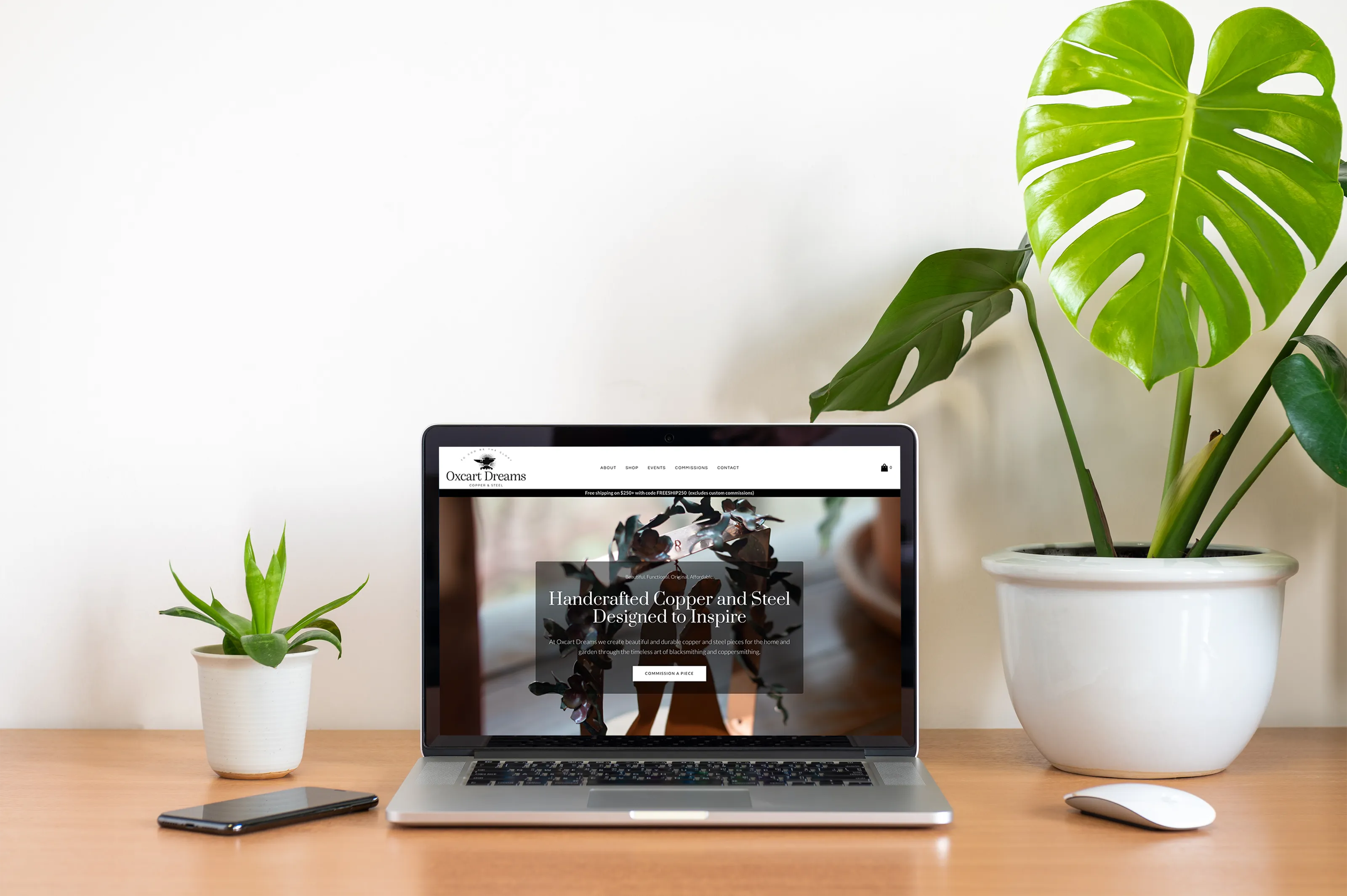 Oxcart website shown in laptop screen on worktable